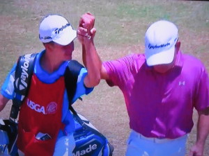 The Quinn twosome raise their arms in triumph walking up the 18th fairway on Father's Day. Photo Credit: NBC Golf & USGA.