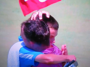 Father Fran & Son Owen embrace after completing 72 holes together in the US Open.